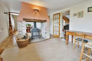 Breakfast area with double sided log burner- click for photo gallery